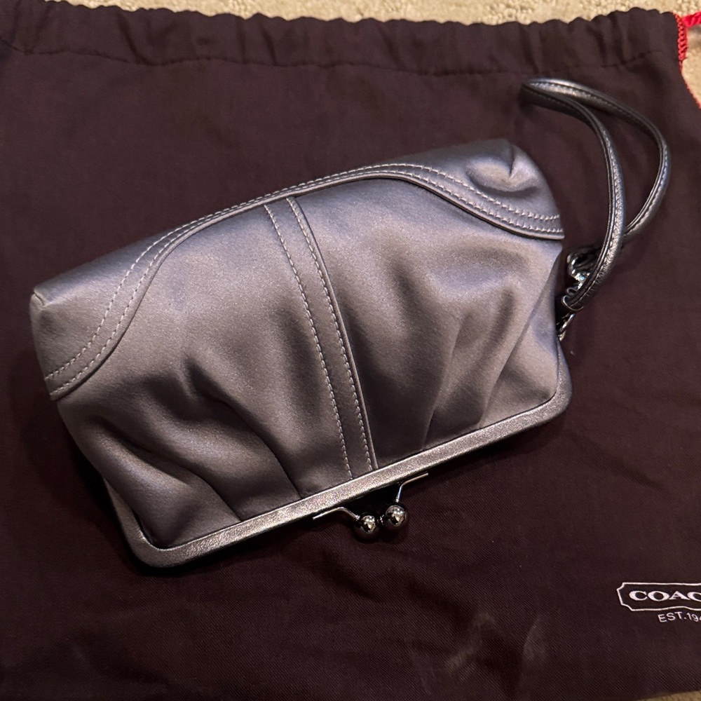 Adorable silver Coach kisslock wristlet